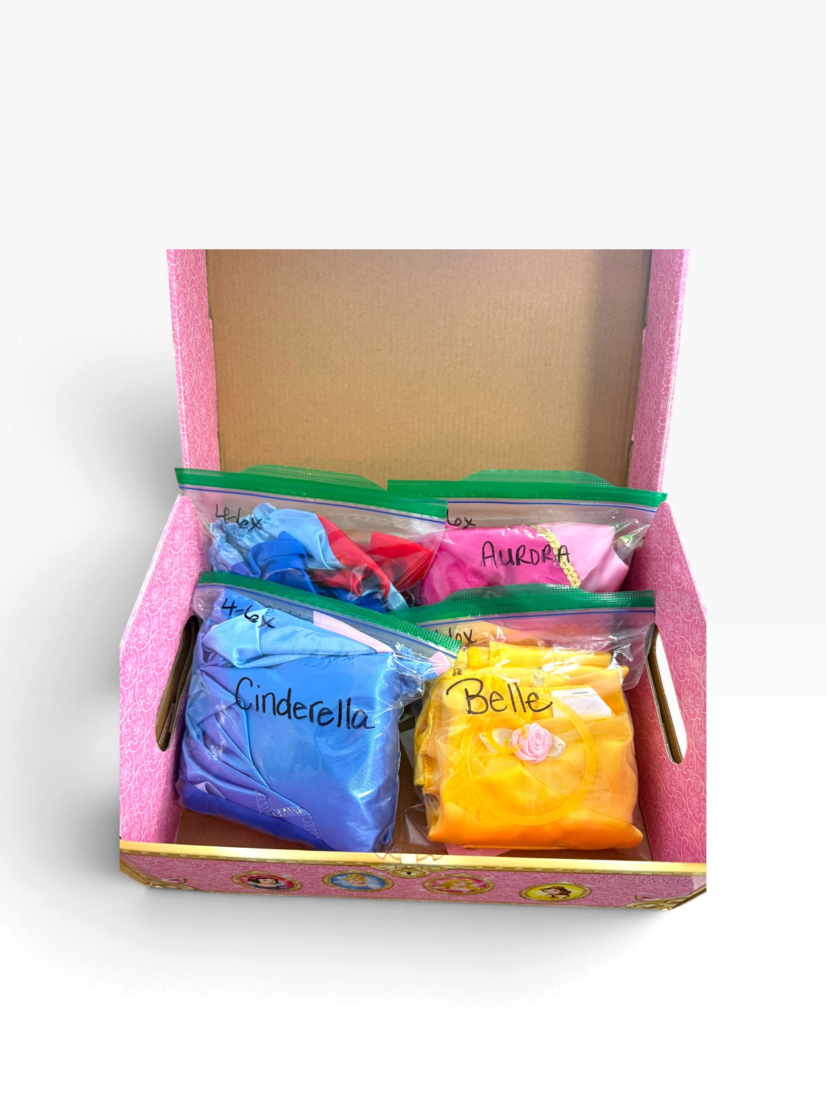 Disney Princess dress up trunk open showing 4 princess dresses inside