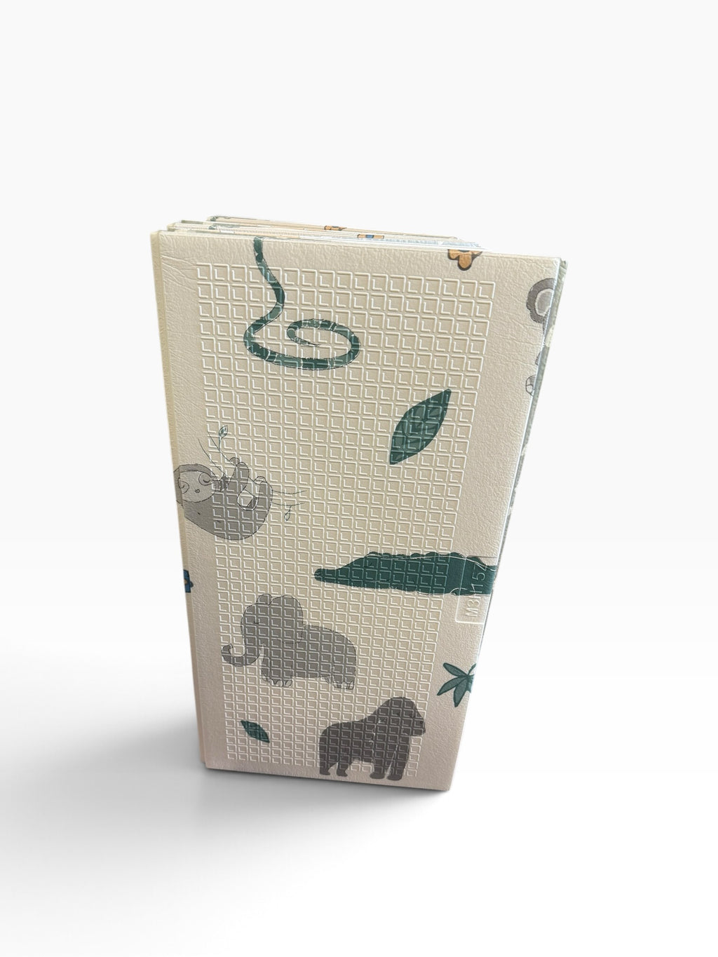 Other side of folded animal print play mat showing elephants and green leaves