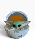 Star Wars Grogu coin bank featuring the green character in a white-and-gray floating pram