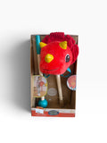 New red plush dinosaur hobby stick toy with yellow horns and wooden stick in packaging