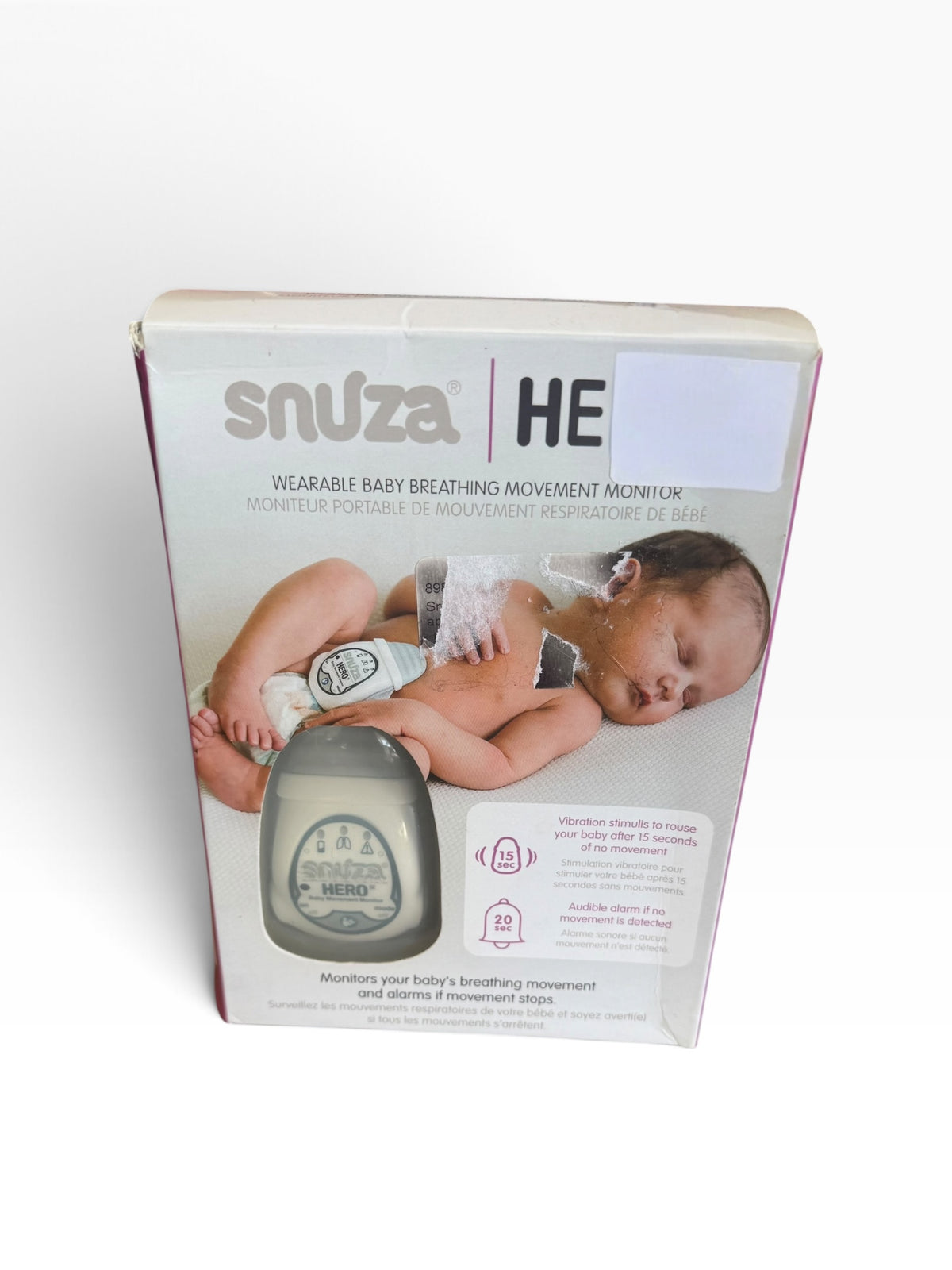 Snuza wearable baby movement monitor retail box showing the monitor clipped to a diaper waistband