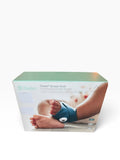 Owlet Dream Sock retail box showing a baby wearing the blue-green sock